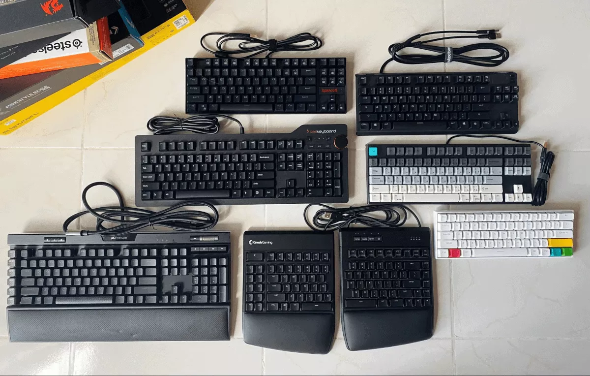 mechanical keyboards laid out on the floor